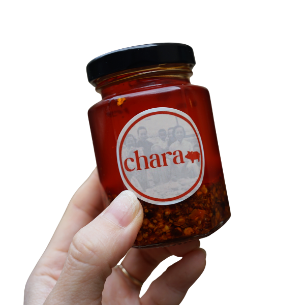 chara Homemade Chili Oil bottle held in hand