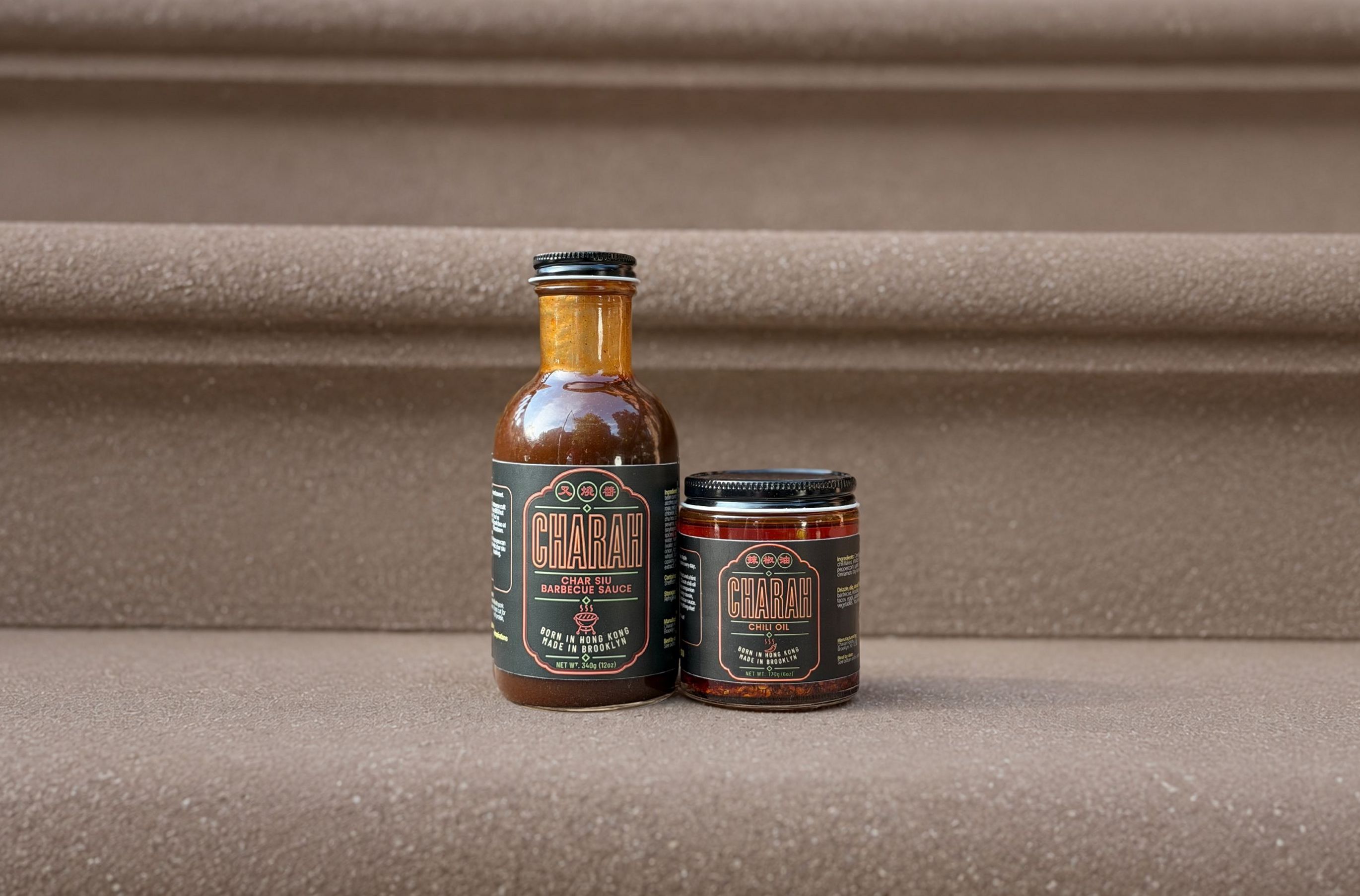 Charah Char Siu BBQ Sauce and Chili Oil jars on a Brooklyn stoop